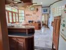 A cozy kitchen with wooden fixtures and a breakfast bar