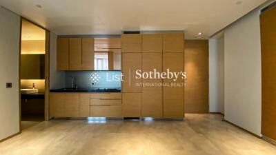 Modern kitchen with built-in wooden cabinets and black countertop