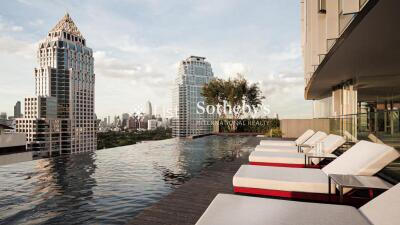 Rooftop pool area with city view and lounge chairs