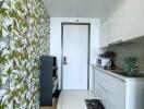 Modern kitchen with patterned wall and white cabinetry