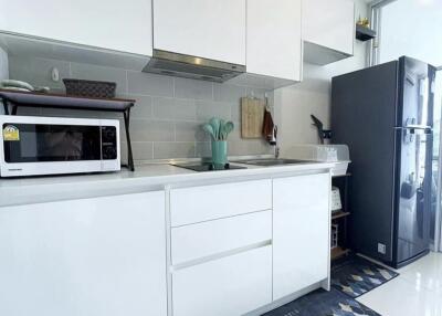 Modern kitchen with white cabinets and appliances