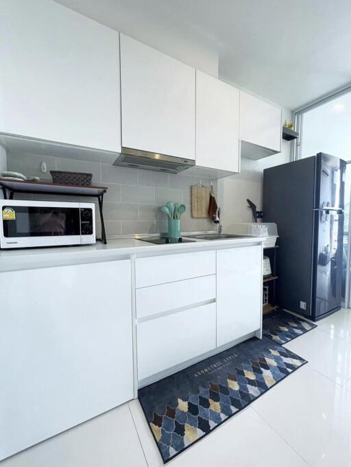 Modern kitchen with white cabinets and appliances