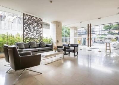 Modern lobby area with contemporary furniture and large windows