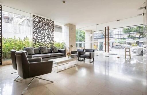 Modern lobby area with contemporary furniture and large windows