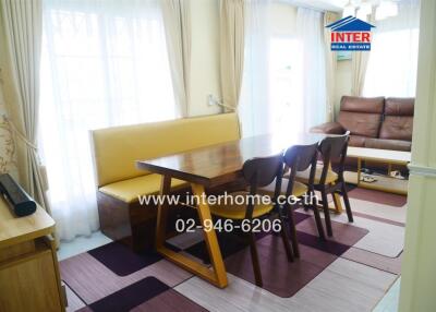 Bright living room with dining table and sofa