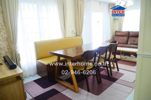 Bright living room with dining table and sofa