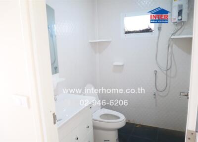 Bathroom with white fixtures and shower