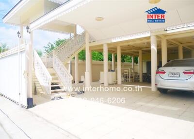 Exterior view of a residential property with a covered carport