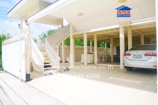 Exterior view of a residential property with a covered carport