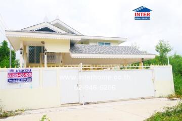 Front view of a house with gated entrance