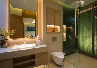 Modern bathroom with glass shower and wooden cabinetry