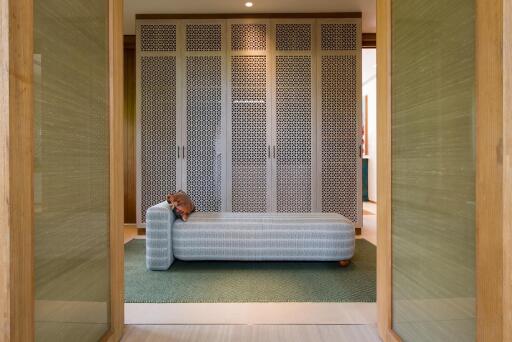 Stylish bedroom with a patterned wardrobe and a daybed