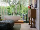 Modern bathroom with a freestanding tub and large window