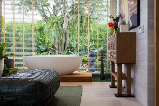 Modern bathroom with a freestanding tub and large window