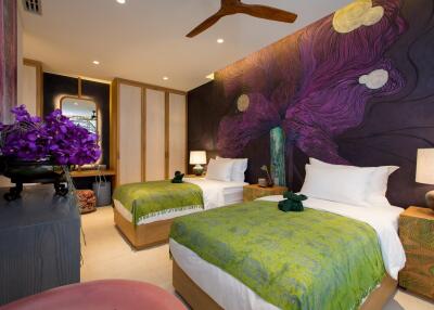 Bedroom with two beds, floral-themed wall art, and modern decor