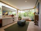 Luxurious bathroom with large mirror and a view of greenery