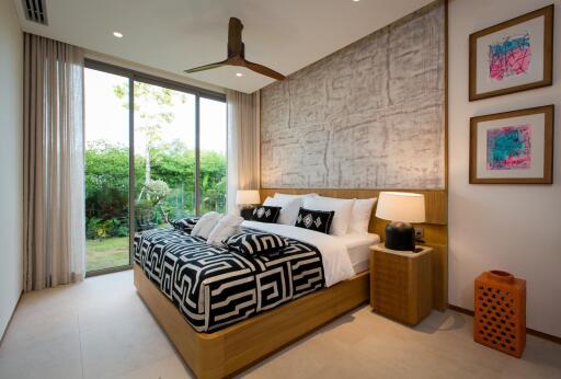 Modern bedroom with large bed and garden view