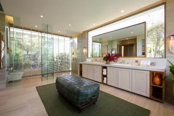 Luxurious modern bathroom with large vanity and spacious seating area