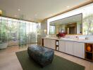 Luxurious modern bathroom with large vanity and spacious seating area