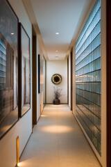 Modern hallway with artwork and decorative lighting