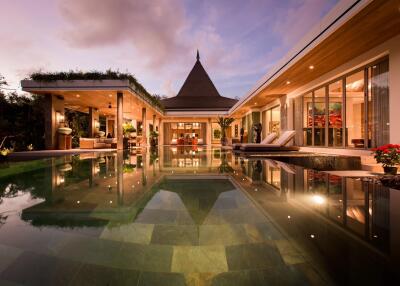 Luxurious modern villa with pool at sunset