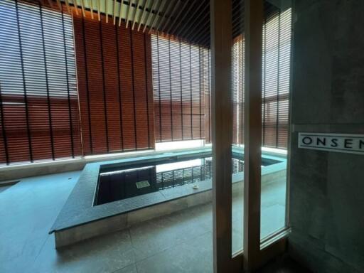 Indoor spa area with sunken pool