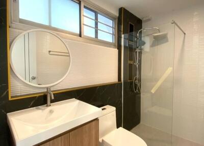 Modern bathroom with shower and vanity