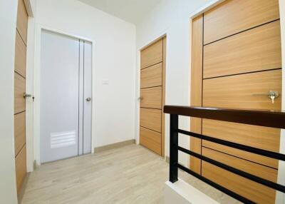 Modern hallway with multiple wooden doors