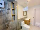 Modern bathroom with glass shower enclosure and mounted showerheads