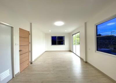 spacious well-lit living area with large windows