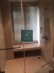 Modern bathroom with shower and window blind