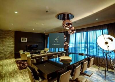 Modern living room with stylish lighting and large dining table