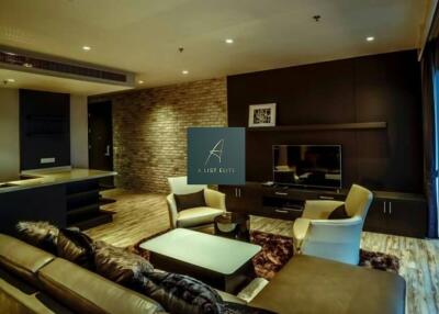 Modern living room with comfy seating and a TV