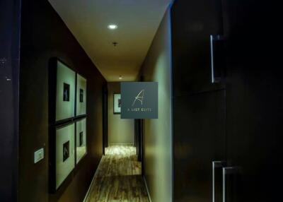 A well-lit modern hallway with wooden flooring