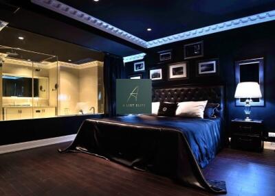 Modern bedroom with dark decor and en-suite bathroom