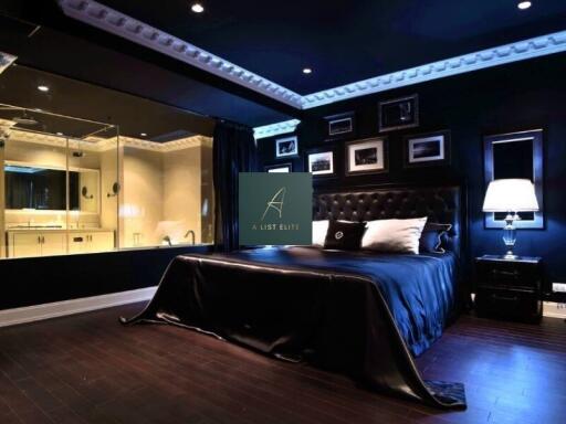 Modern bedroom with dark decor and en-suite bathroom