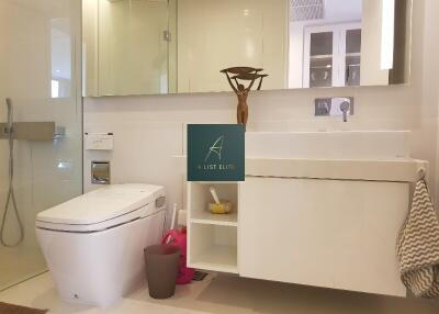 Modern bathroom with large mirror and storage