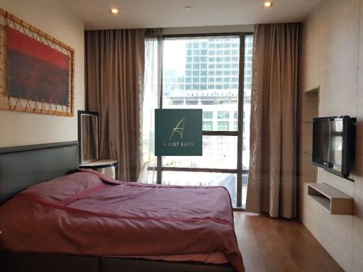 Modern bedroom with large window and city view