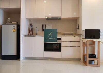 Modern kitchen with white cabinetry and appliances