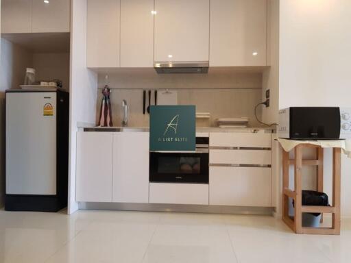 Modern kitchen with white cabinetry and appliances