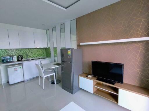 Modern living space with kitchen and entertainment area