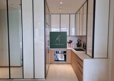 Modern kitchen with sleek white cabinetry and appliances