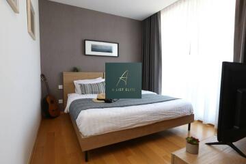 Modern bedroom with wooden flooring