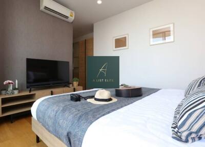 Modern bedroom with a TV and air conditioning