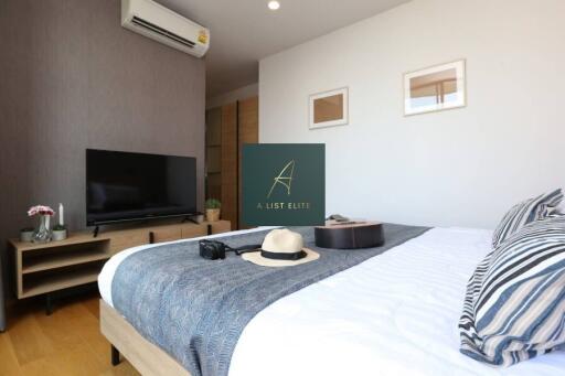 Modern bedroom with a TV and air conditioning