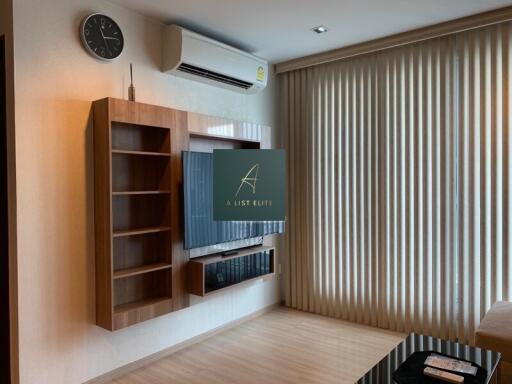 Modern living room with wall-mounted TV and air conditioning