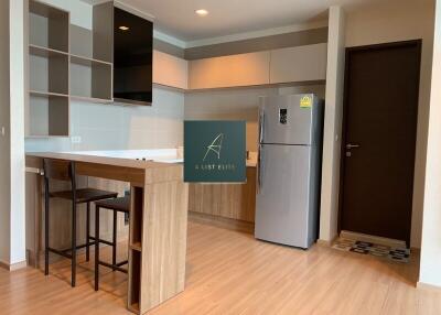 Modern kitchen with wood finish cabinets and island