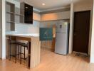 Modern kitchen with wood finish cabinets and island