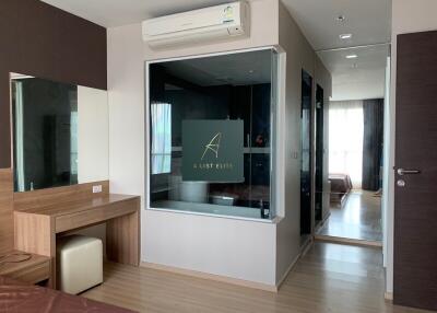 Modern bedroom with ensuite bathroom and wooden furnishings