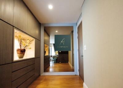 Hallway view with decorative elements and large mirror